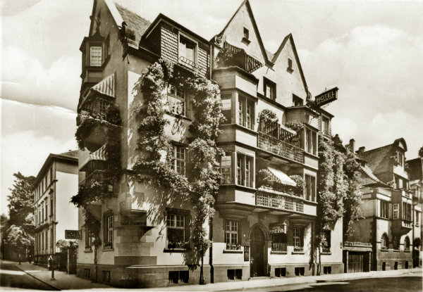 The family lived in the beautiful medieval university town of Freiburg im Breisgau in the warm, southwest corner of Germany. Their home at Poststrasse 6 stood to the right of the Hotel Minerva.